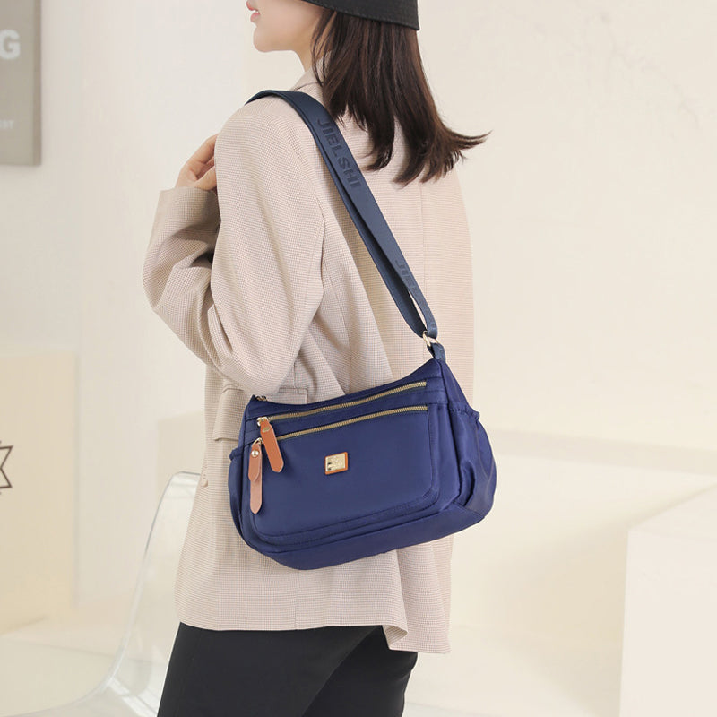 Multi-compartment shoulder bag