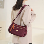 Multi-compartment shoulder bag